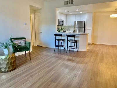 Looking across the living room to the kitchen breakfast bar