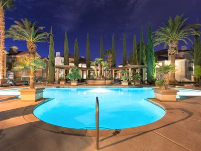 Ritiro community pool at night with ambient lighting