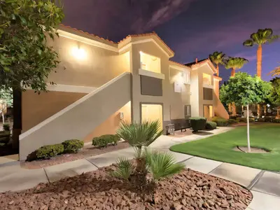 Apartment buildings at dusk with professional landscaping