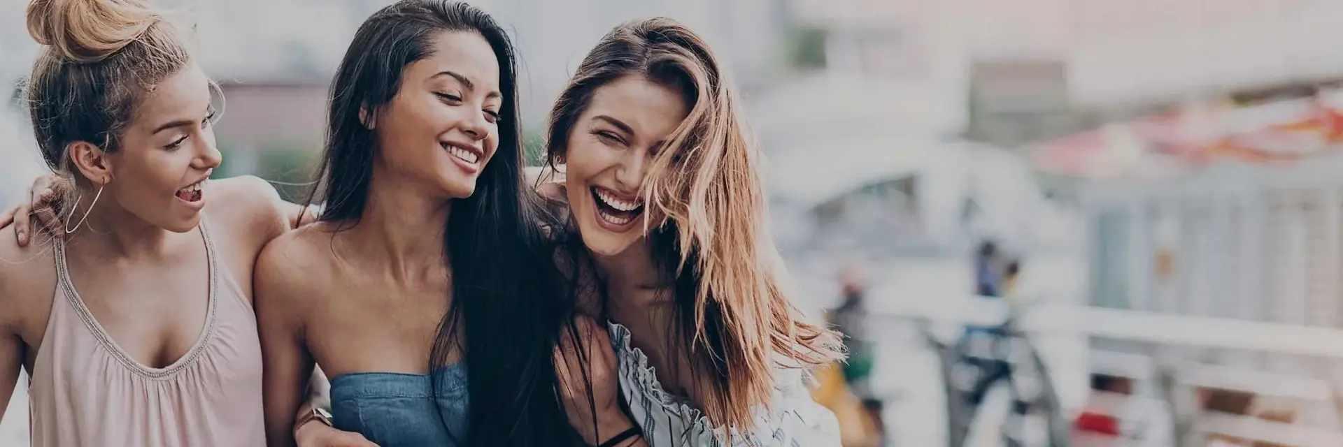 Friends laughing together in Peccole Ranch neighborhood near Ritiro Apartments Las Vegas