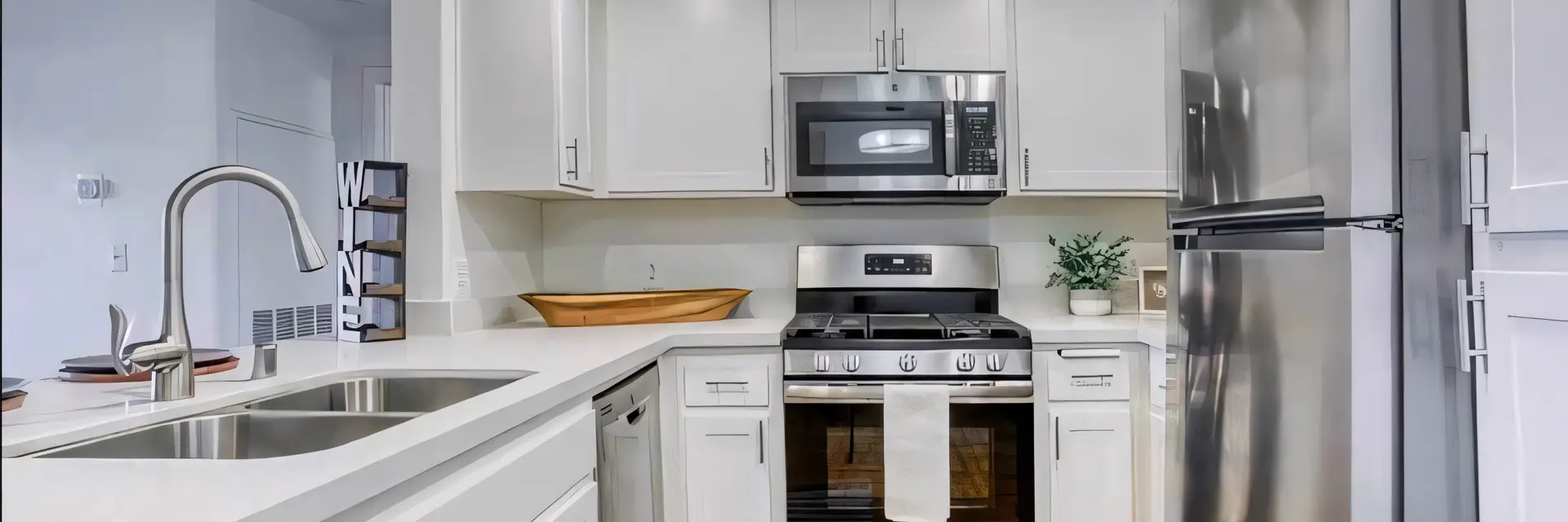 Ritiro Apartments white cabinet kitchen with stainless steel appliance package in Peccole Ranch Las Vegas